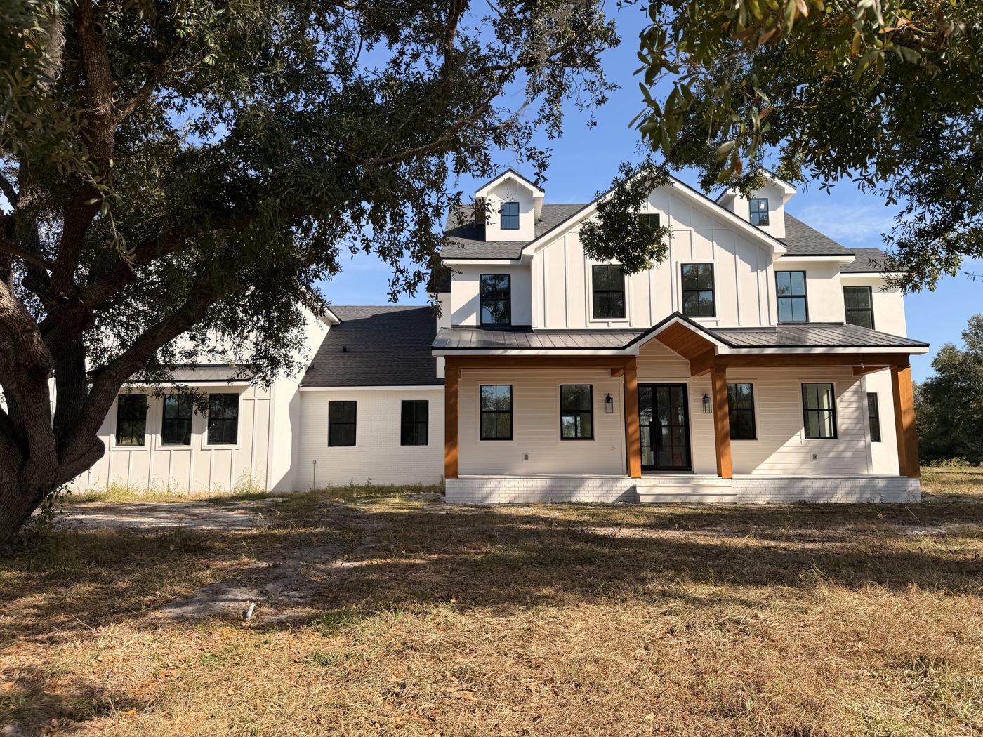 Farmhouse-style home with new windows and doors